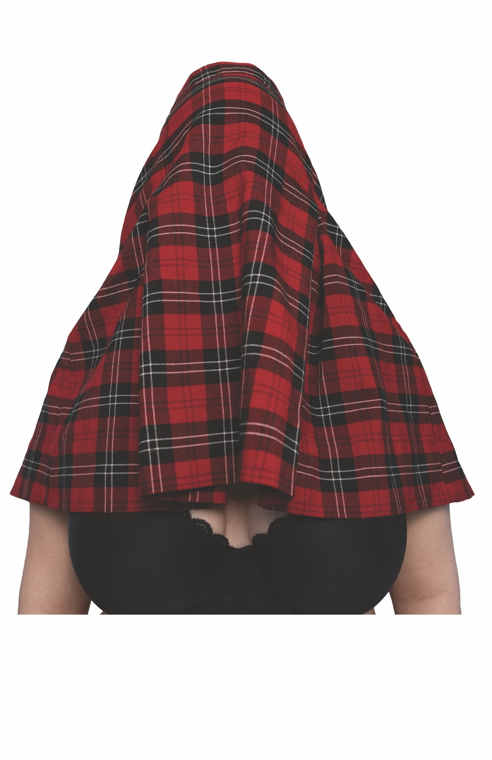 A bust shot of a woman whose head is covered with a tartan scarf